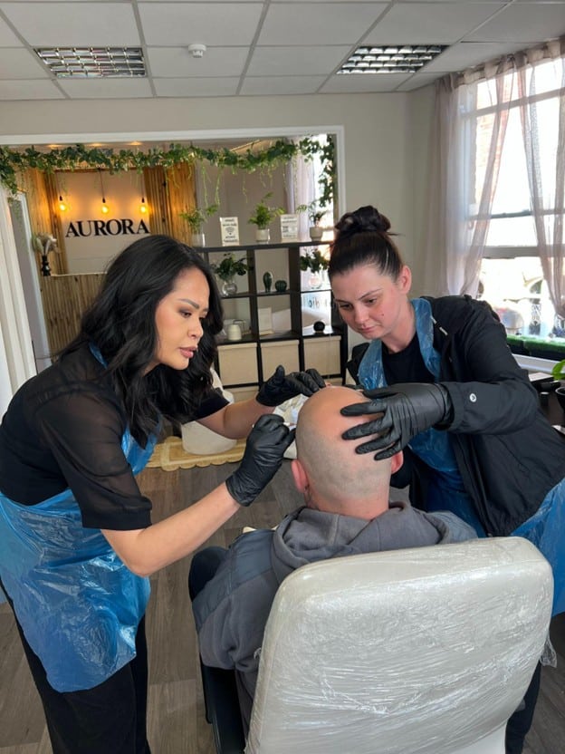 Student learning scalp micropigmentation using the ELL Technique at SMP-Clinic & Training Academy in Stockport